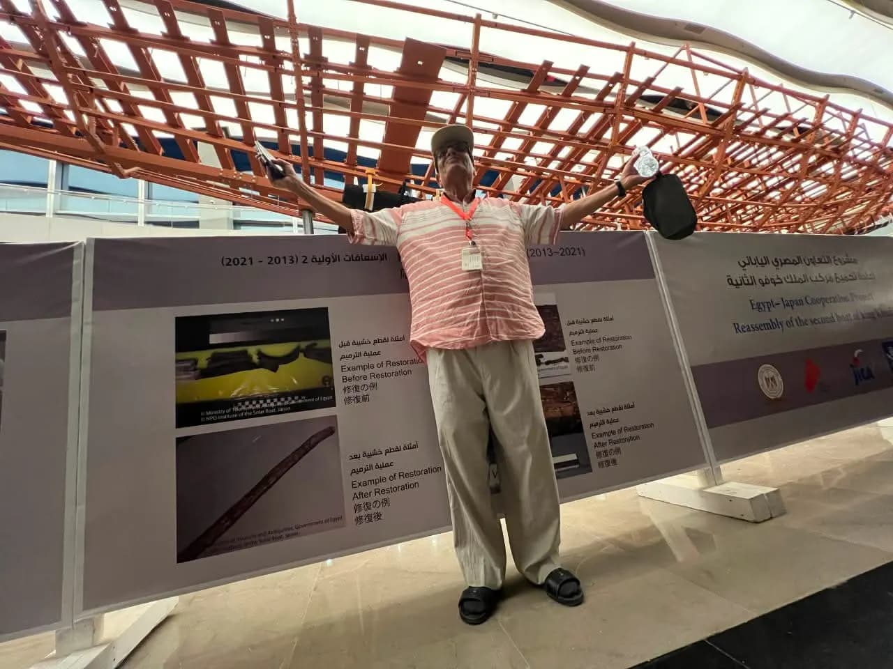 A traveler at King Khufu's solar boat exhibit, Grand Egyptian Museum