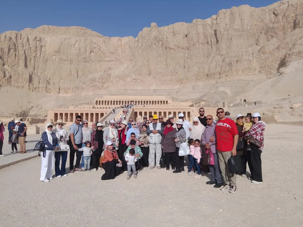 A large tour group in front of the Temple of Hatshepsut, Luxor