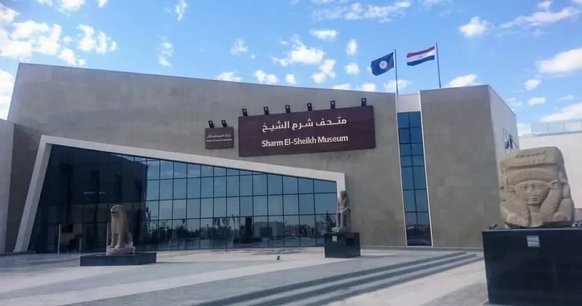 The Sharm El-Sheikh Museum exterior with pharaonic statues and an Egyptian flag
