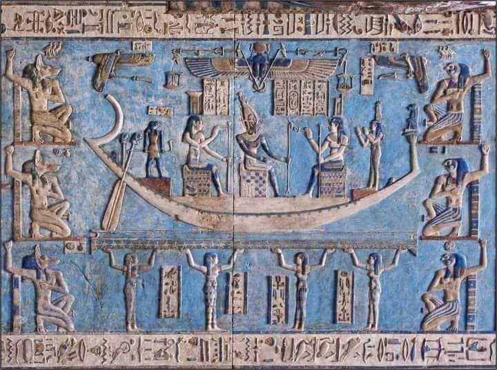 A painted blue relief of a solar barque and deities in an ancient temple