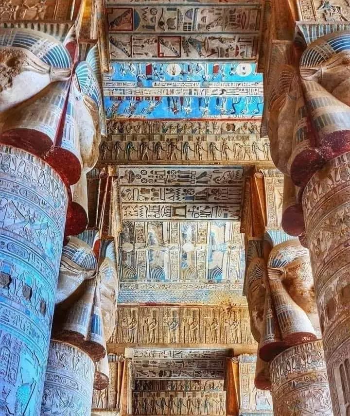 Vividly painted columns and ceiling of the hypostyle hall at Dendera Temple